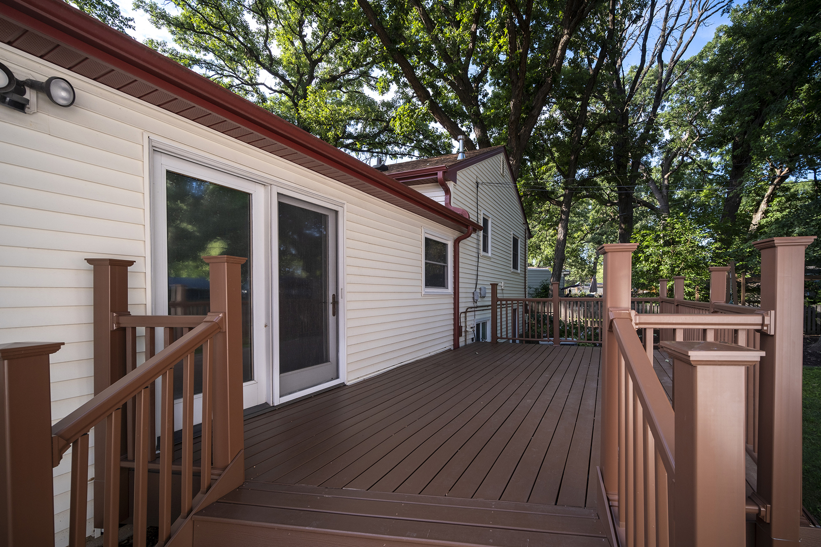 47 Briarcliff Road Montgomery, IL 60538 - Photo 17 of 19 a view of a house with wooden deck and a large tree