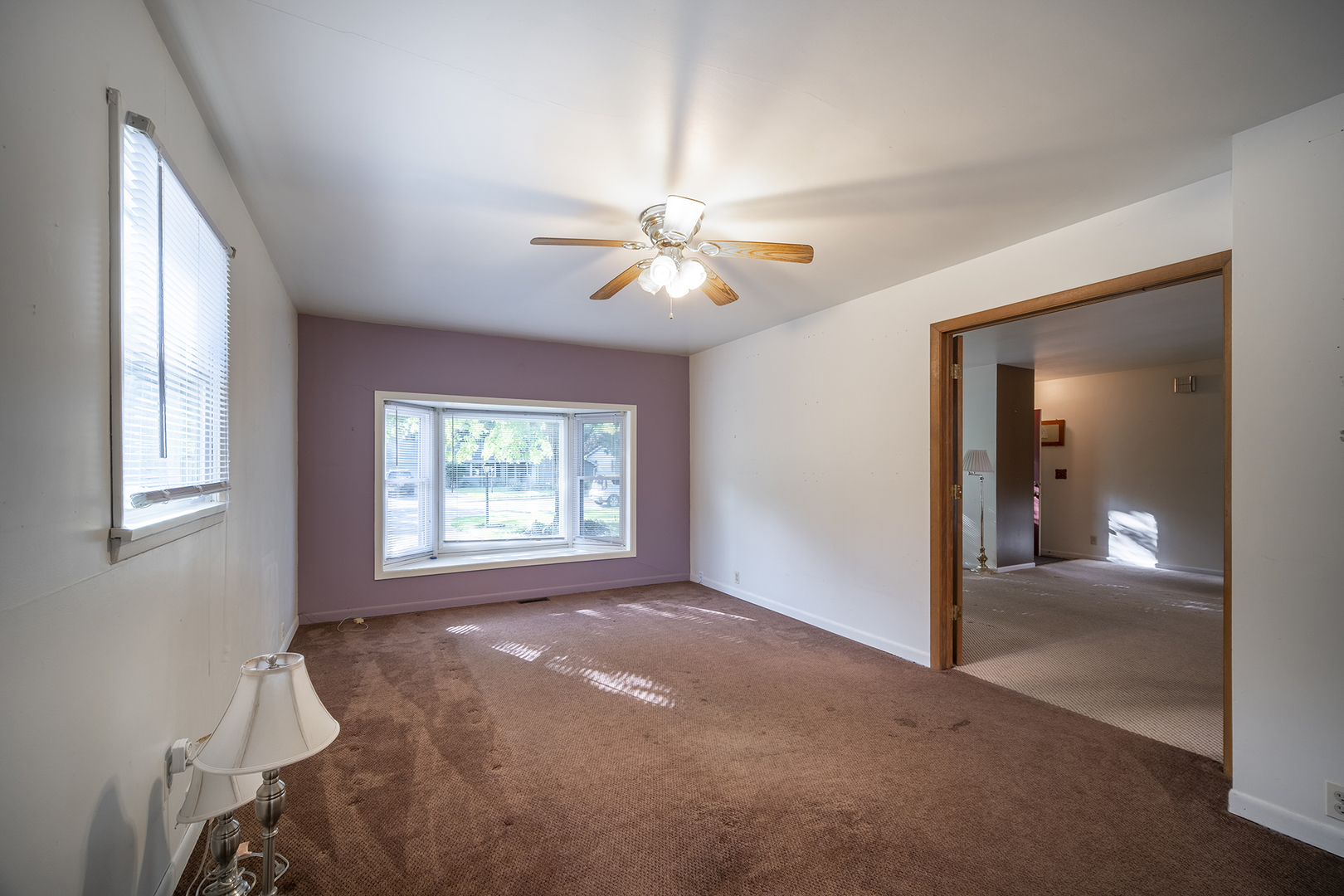47 Briarcliff Road Montgomery, IL 60538 - Photo 7 of 19 a view of a livingroom with a ceiling fan and window