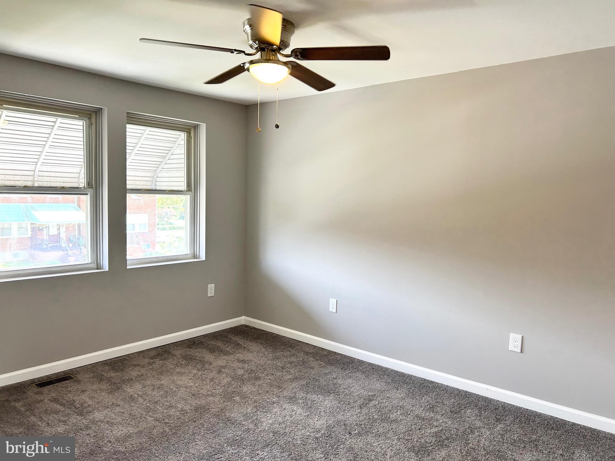 3506 Elmora Avenue Baltimore, MD 21213 - Photo 16 of 27 a view of an empty room with a window