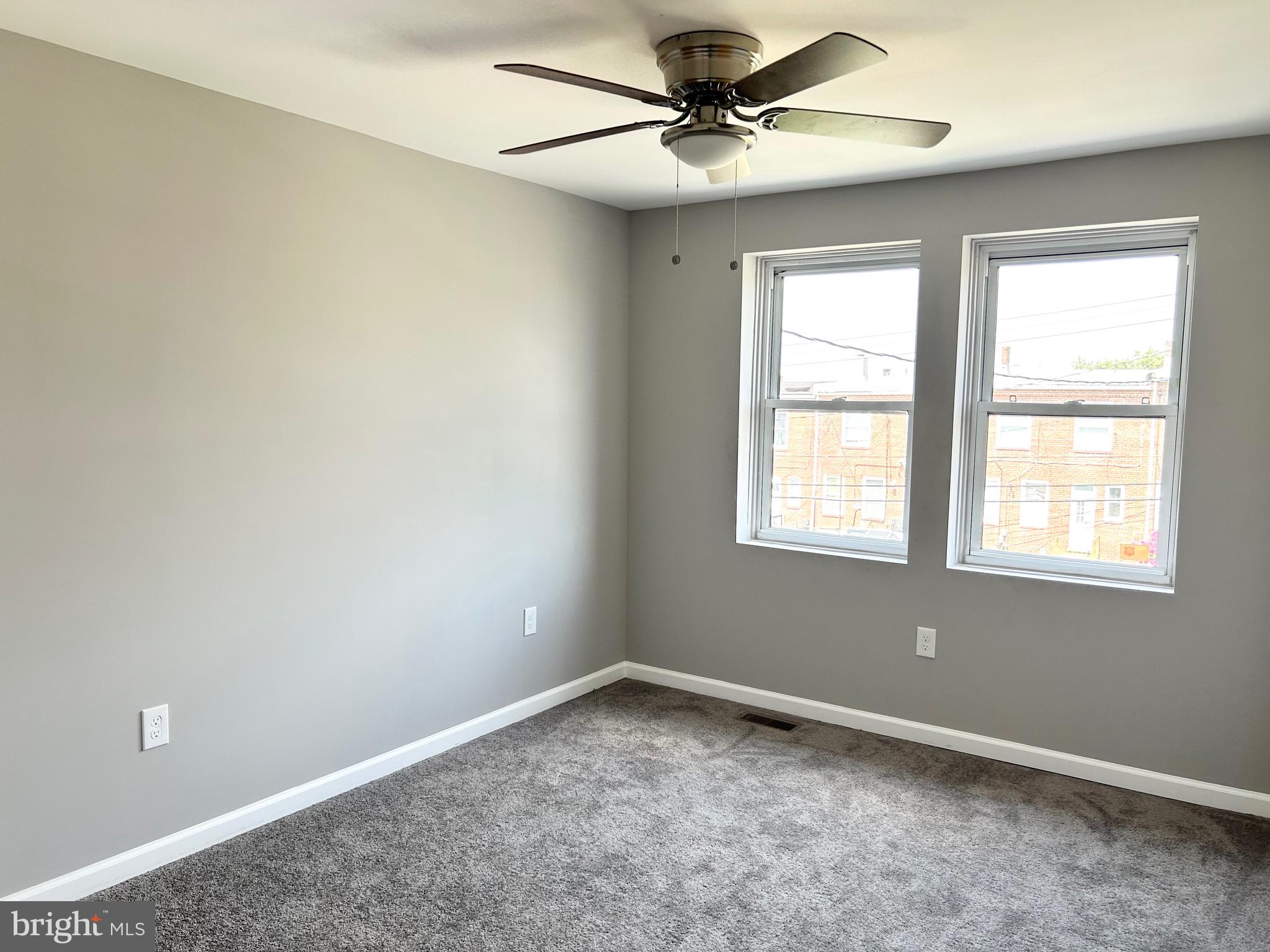 3506 Elmora Avenue Baltimore, MD 21213 - Photo 17 of 27 a view of an empty room with a window