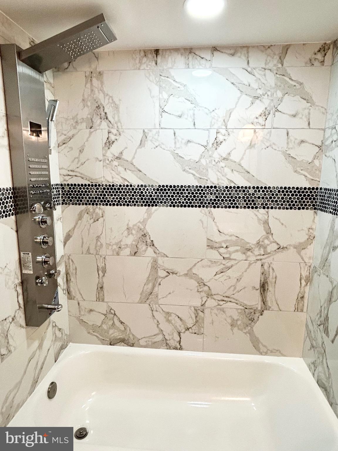 3506 Elmora Avenue Baltimore, MD 21213 - Photo 24 of 27 a bathroom with a bathtub