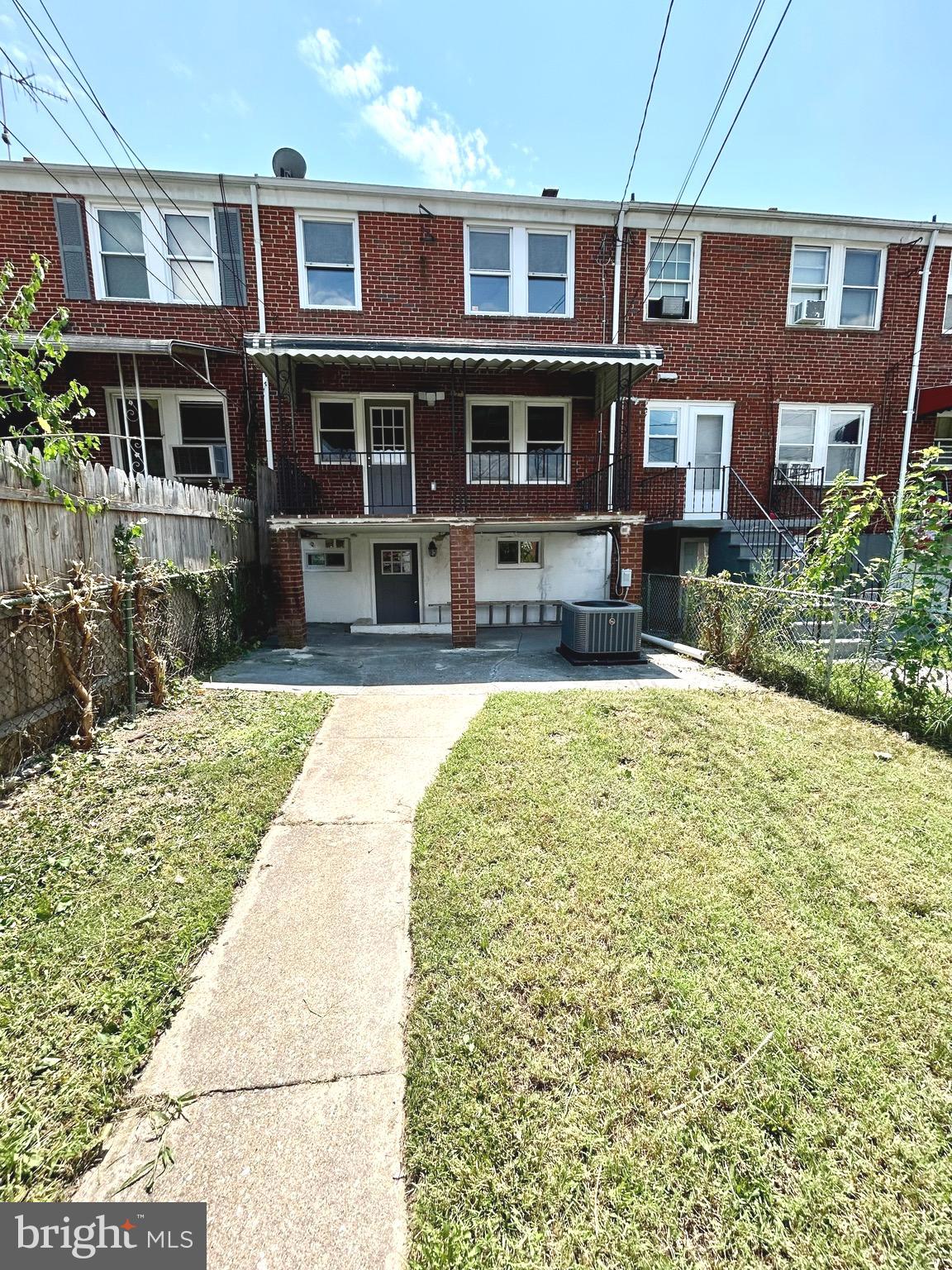 3506 Elmora Avenue Baltimore, MD 21213 - Photo 26 of 27 a view of a building with a yard