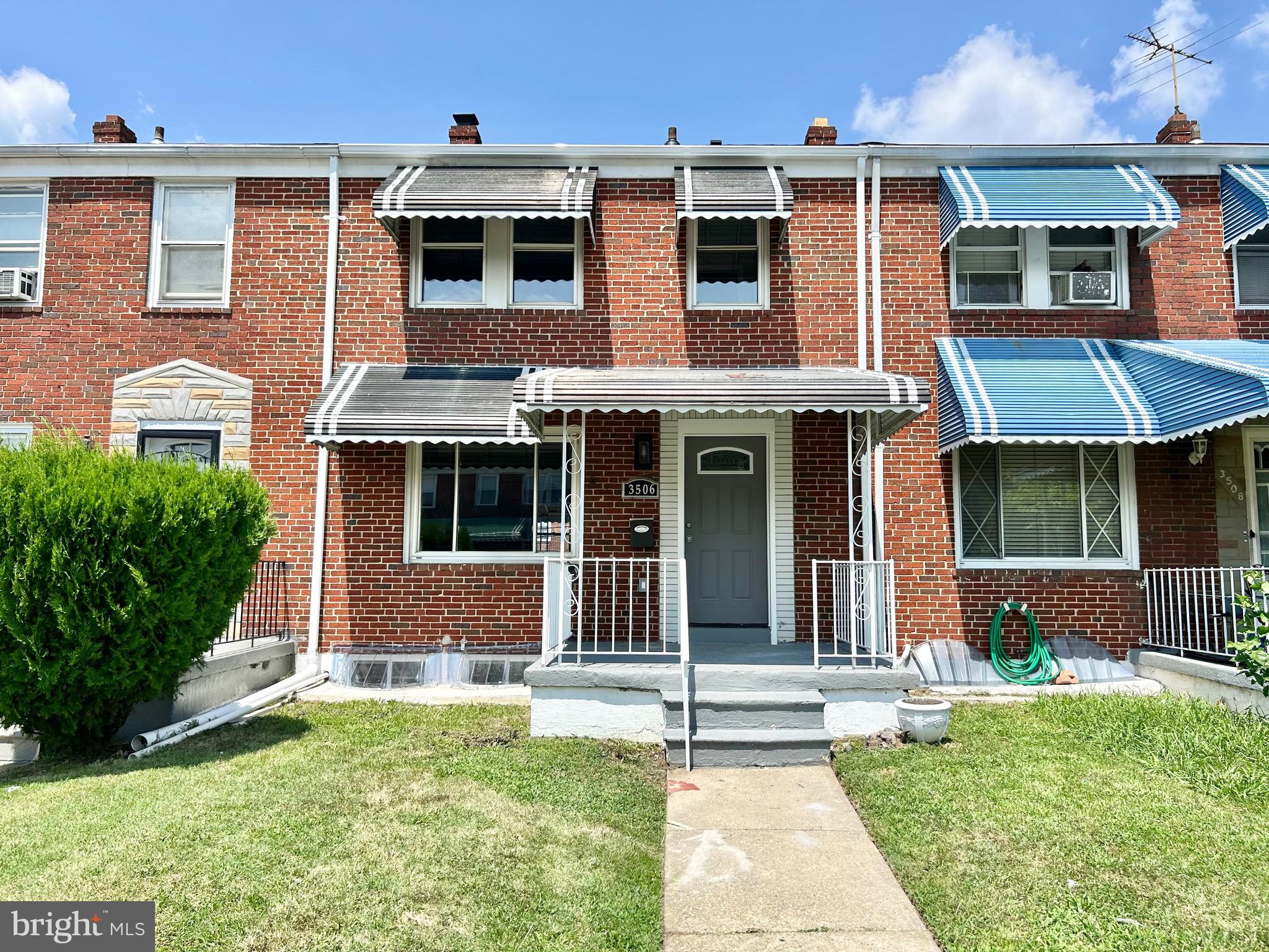 3506 Elmora Avenue Baltimore, MD 21213 - Photo 27 of 27 a front view of a house with a yard