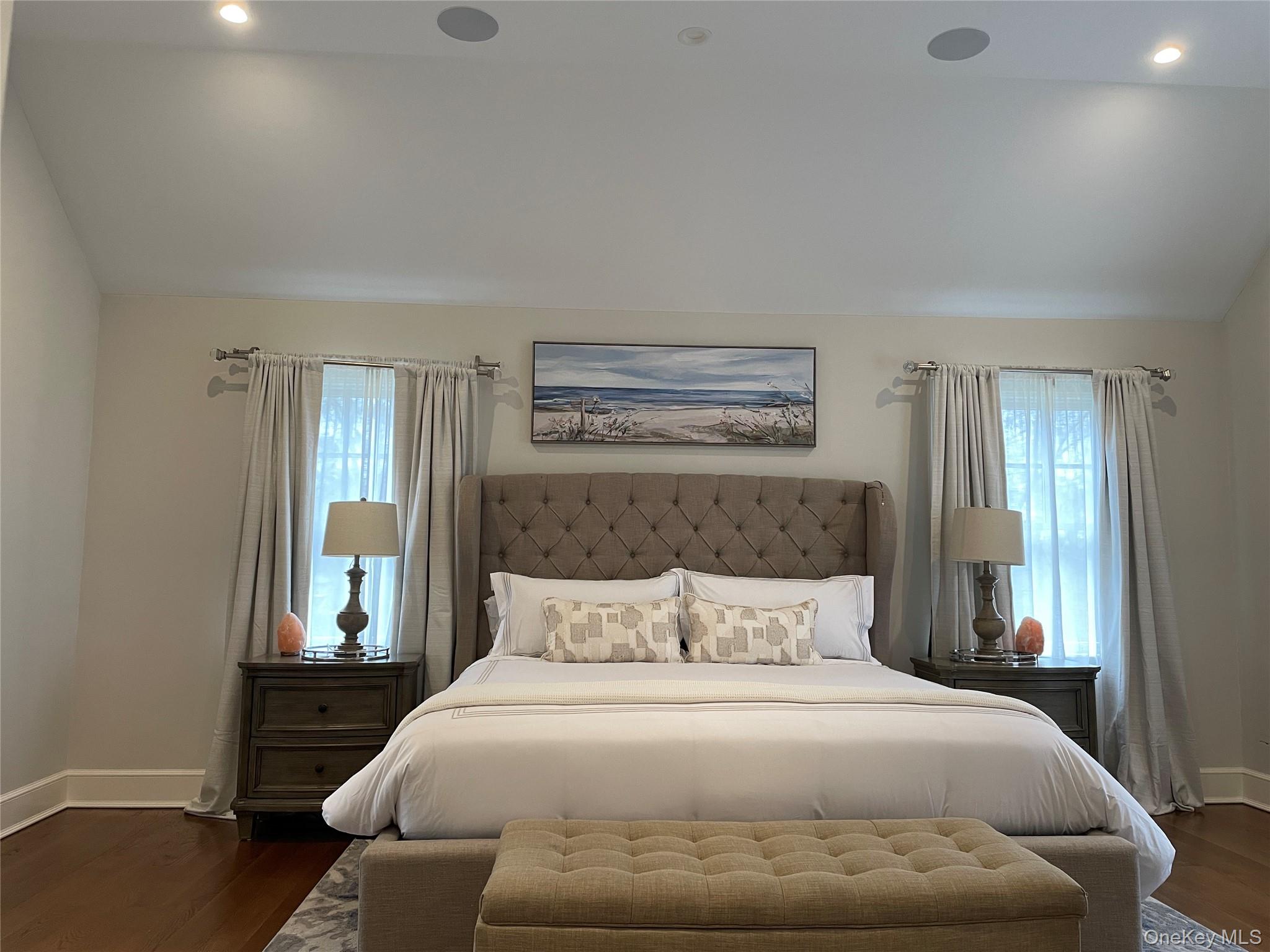 99 Spinney Road East Quogue, NY 11942 - Photo 19 of 40 a bedroom with a bed and a window