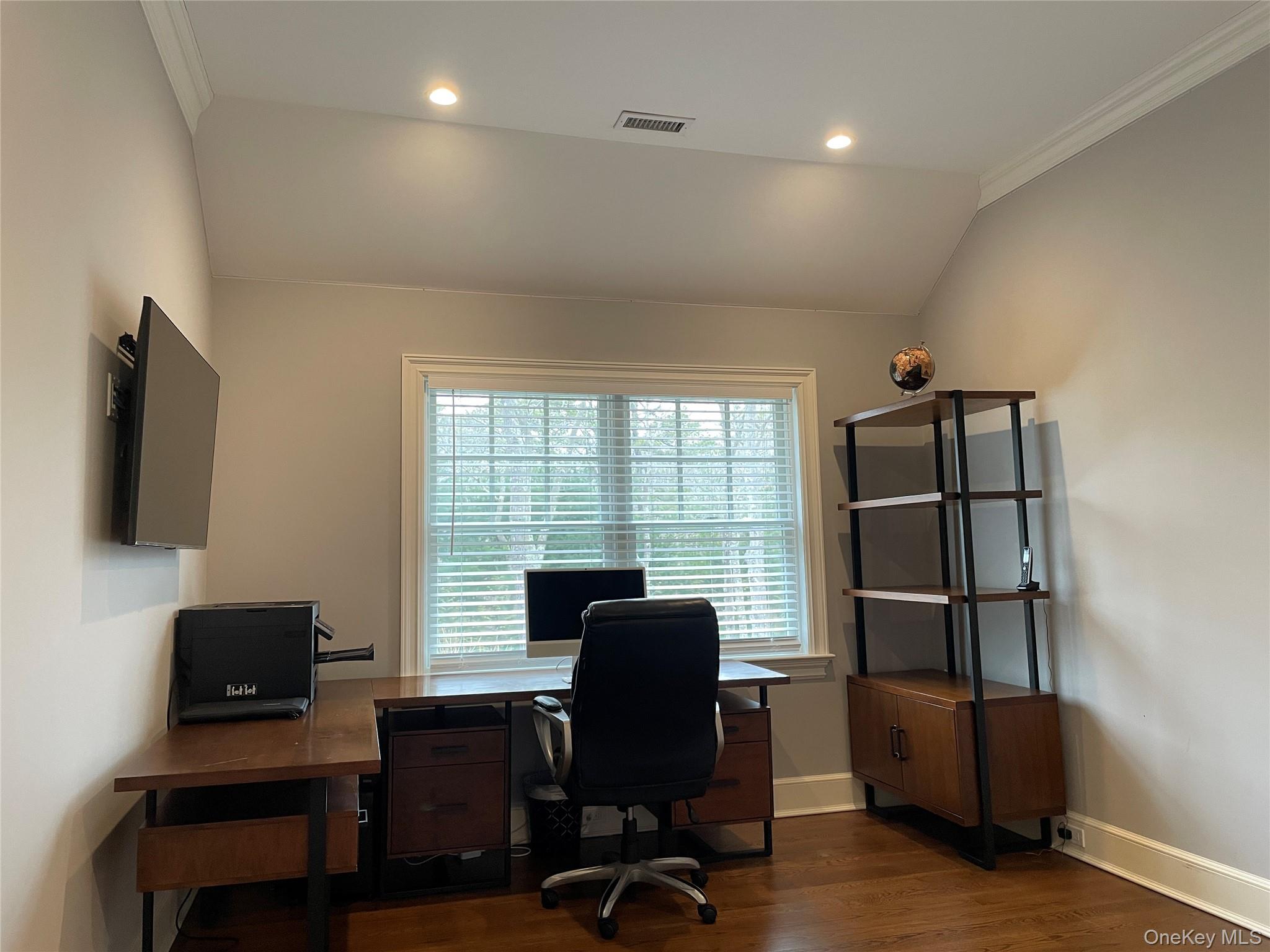 99 Spinney Road East Quogue, NY 11942 - Photo 28 of 40 a view of a workspace with furniture and a window