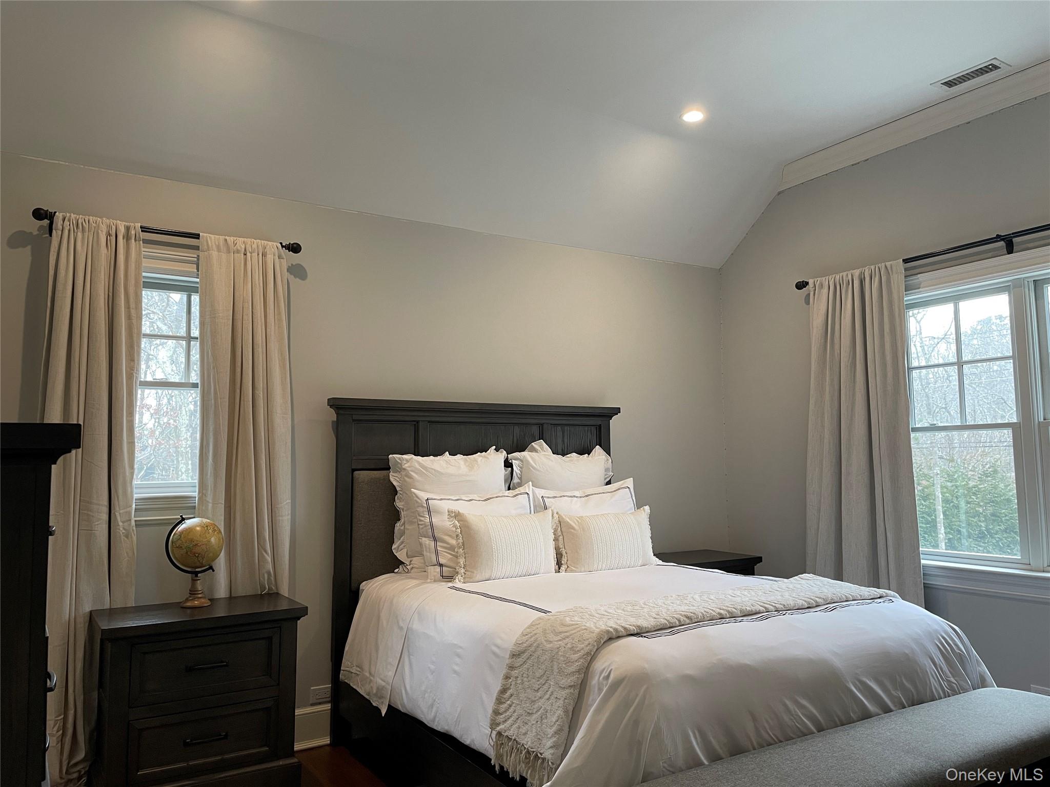 99 Spinney Road East Quogue, NY 11942 - Photo 30 of 40 a bedroom with bed and window