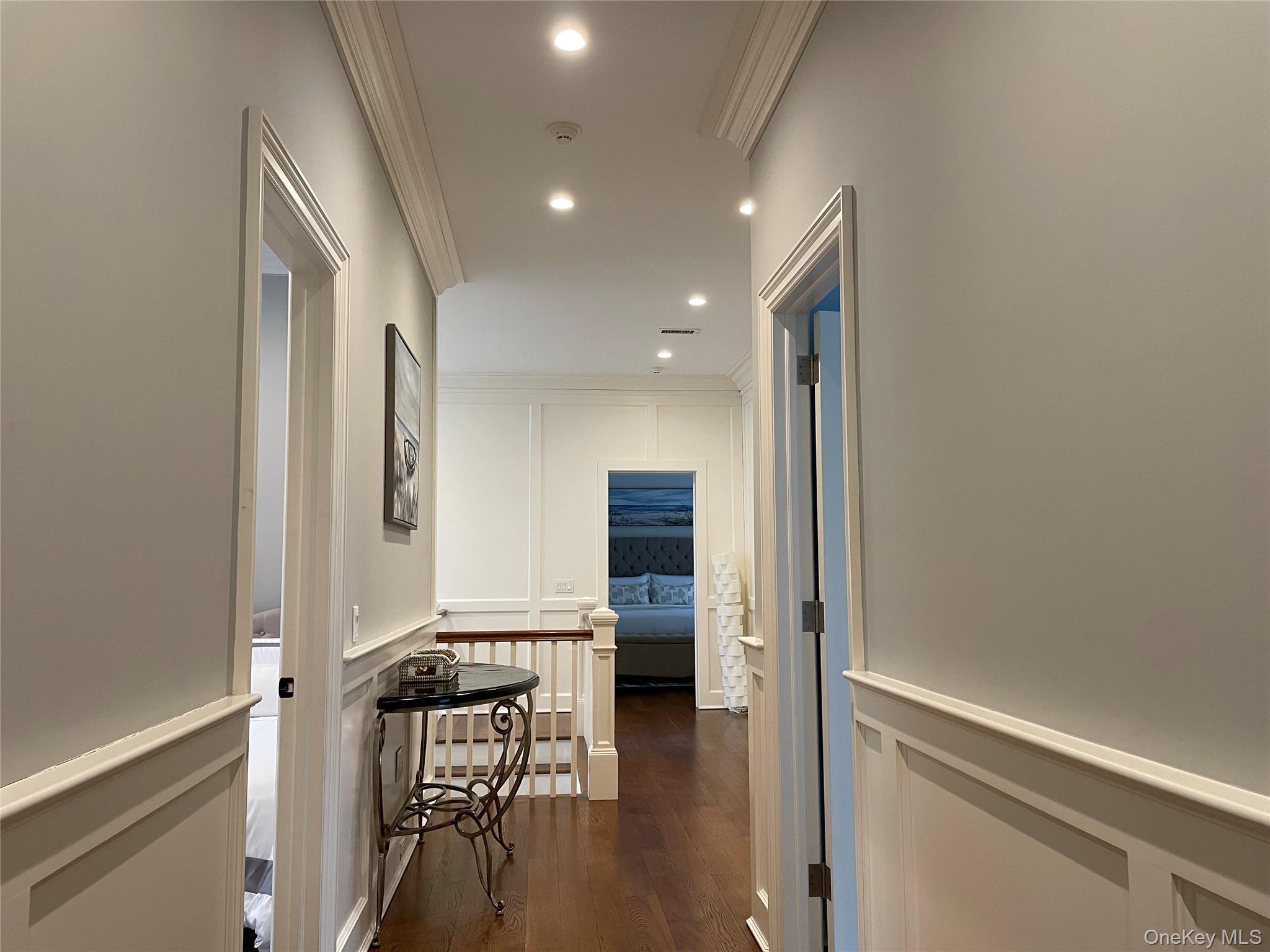 99 Spinney Road East Quogue, NY 11942 - Photo 33 of 40 a view of a hallway with wooden floor windows and livingroom