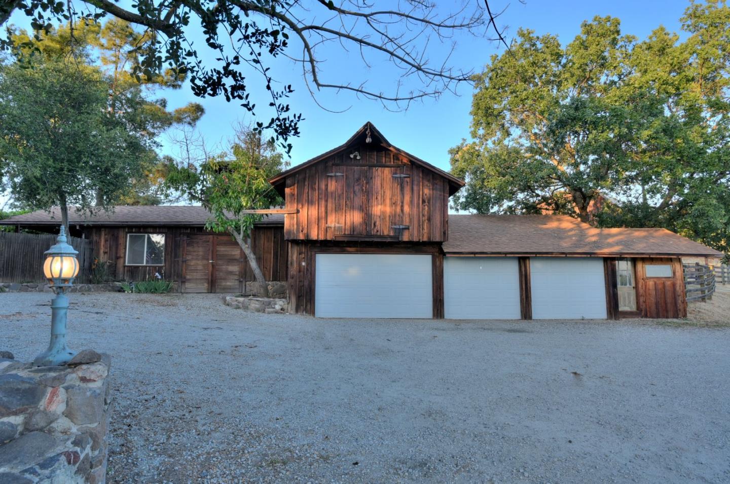 7700 Crews Road Gilroy, CA 95020 - Photo 3 of 28 a view of a house with a yard and a tree
