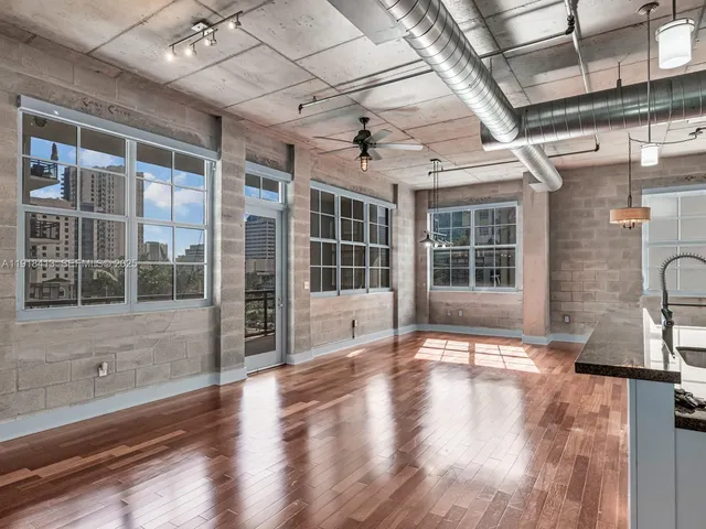 a view of a livingroom with wooden floor