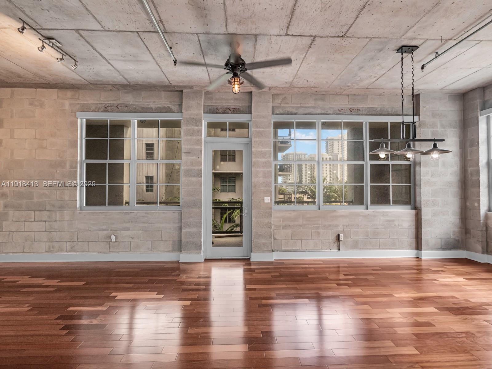411 Northwest 1st Avenue, Unit 401 Fort Lauderdale, FL 33301 - Photo 15 of 53 a view of a livingroom with wooden floor and a sink