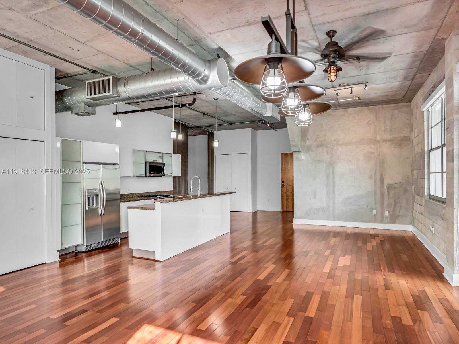 411 Northwest 1st Avenue, Unit 401 Fort Lauderdale, FL 33301 - Photo 16 of 53 a view of a room with wooden floor