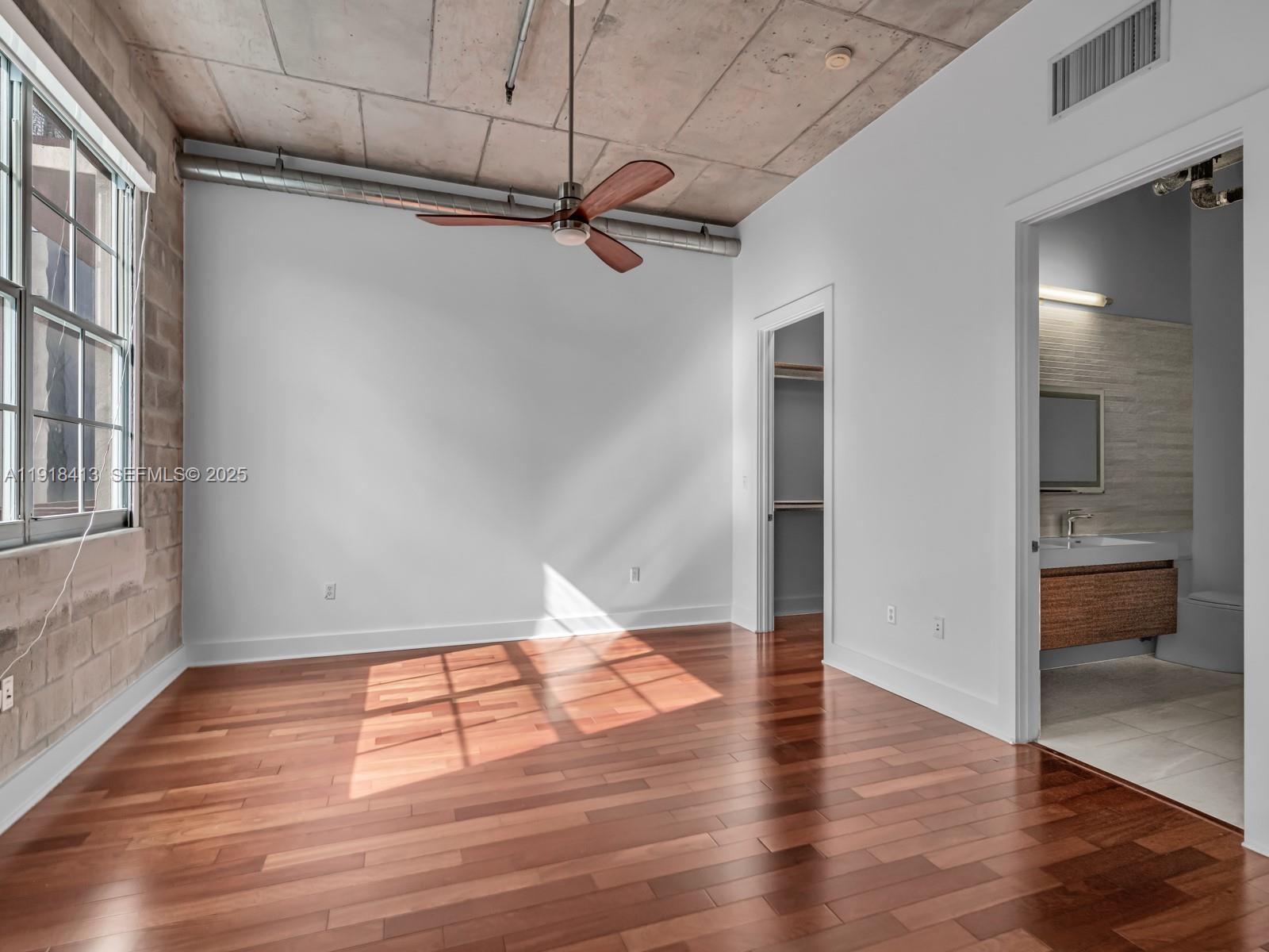 411 Northwest 1st Avenue, Unit 401 Fort Lauderdale, FL 33301 - Photo 21 of 53 a view of empty room with wooden floor