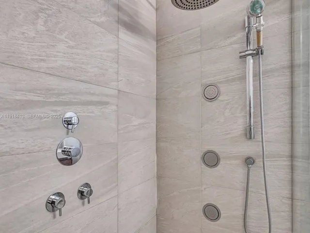 a view of walk in closet with wooden floor