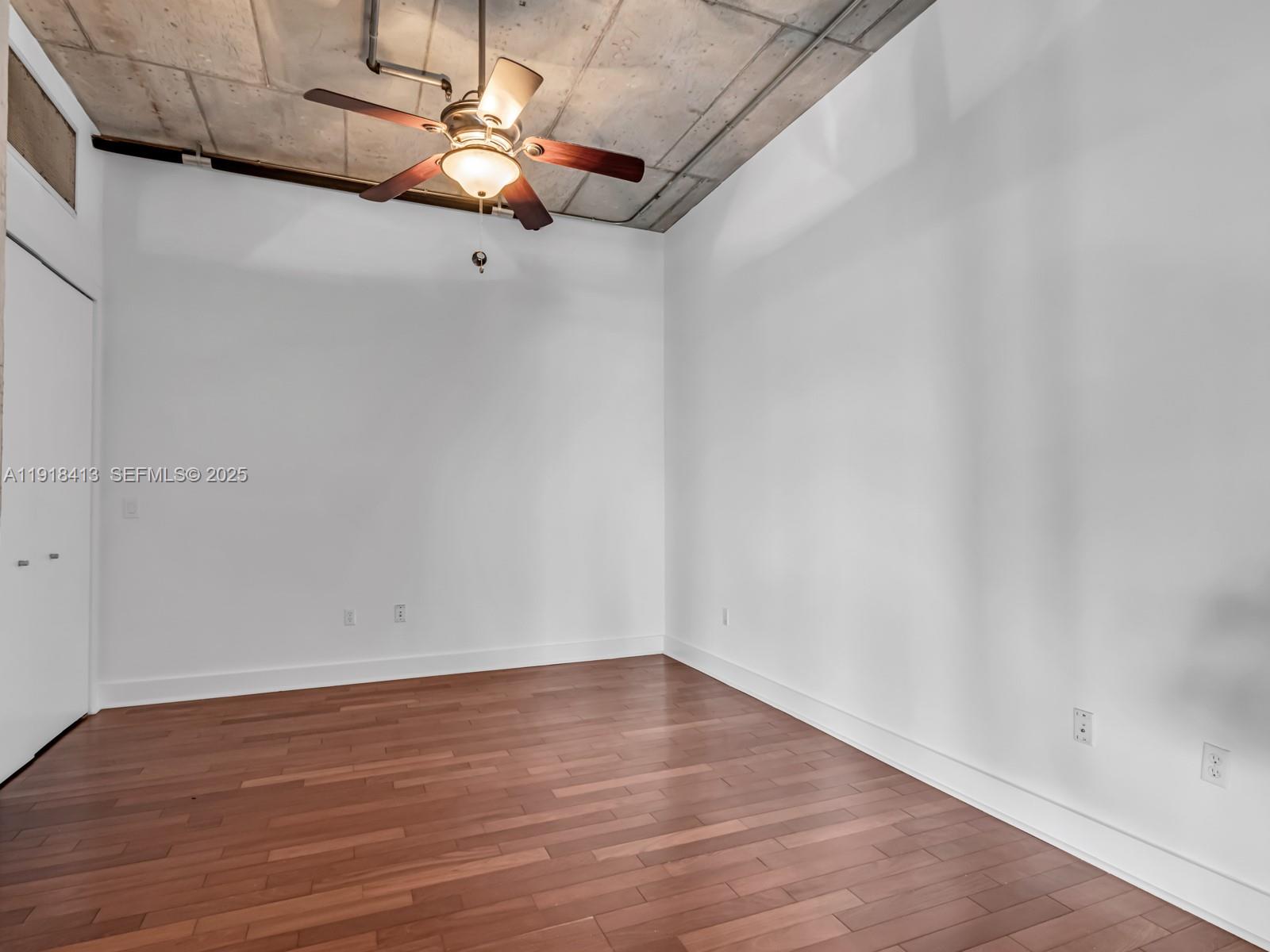 411 Northwest 1st Avenue, Unit 401 Fort Lauderdale, FL 33301 - Photo 28 of 53 a view of an empty room with wooden floor