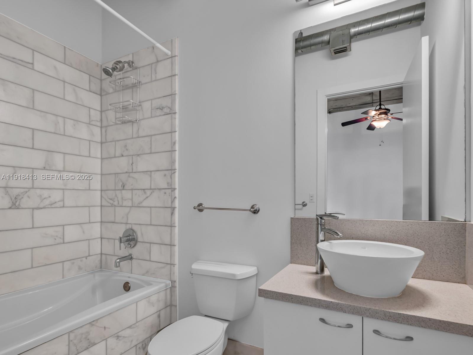 411 Northwest 1st Avenue, Unit 401 Fort Lauderdale, FL 33301 - Photo 31 of 53 a bathroom with a shower a toilet and a bathtub