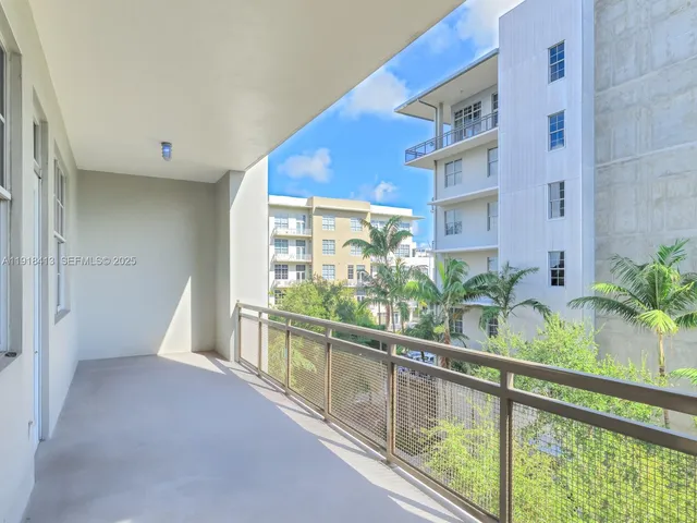 a backyard of a house with a yard and outdoor seating