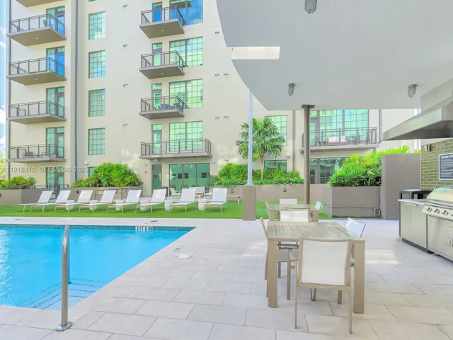 a kitchen with a stove and refrigerator