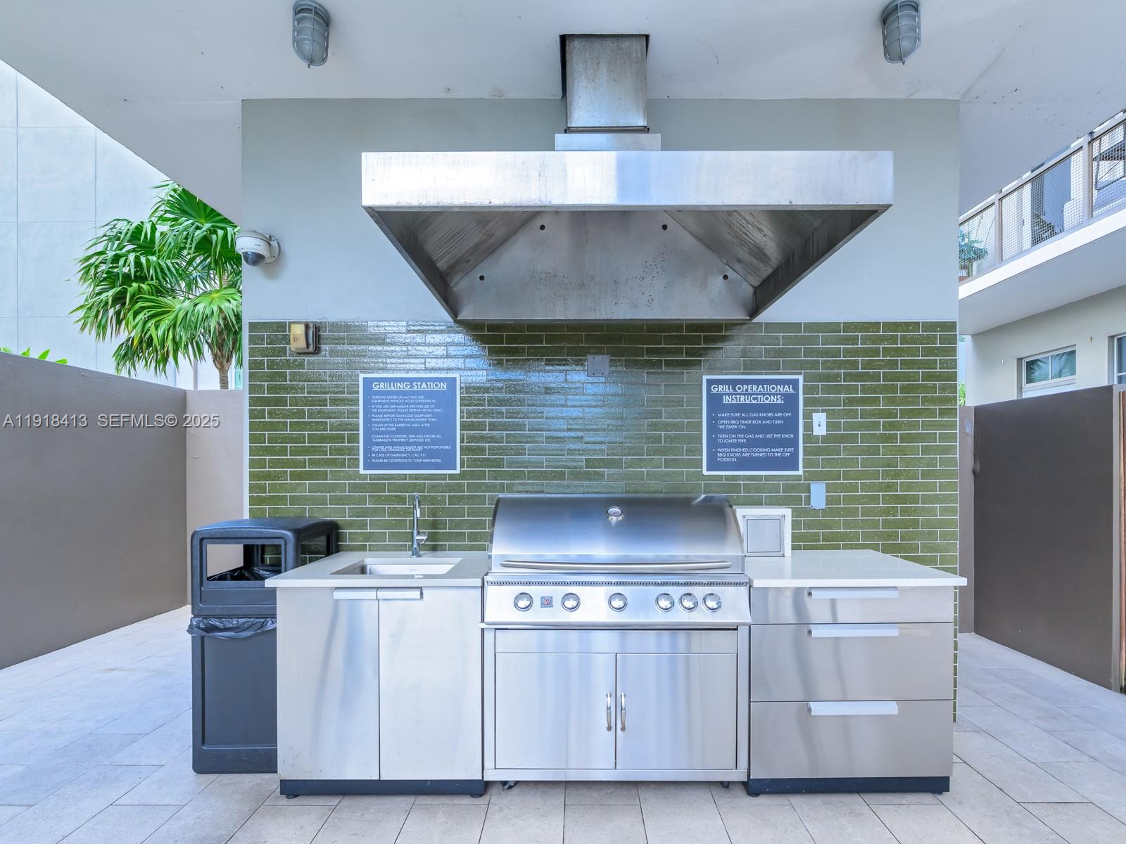 411 Northwest 1st Avenue, Unit 401 Fort Lauderdale, FL 33301 - Photo 41 of 53 a kitchen with a stove and refrigerator