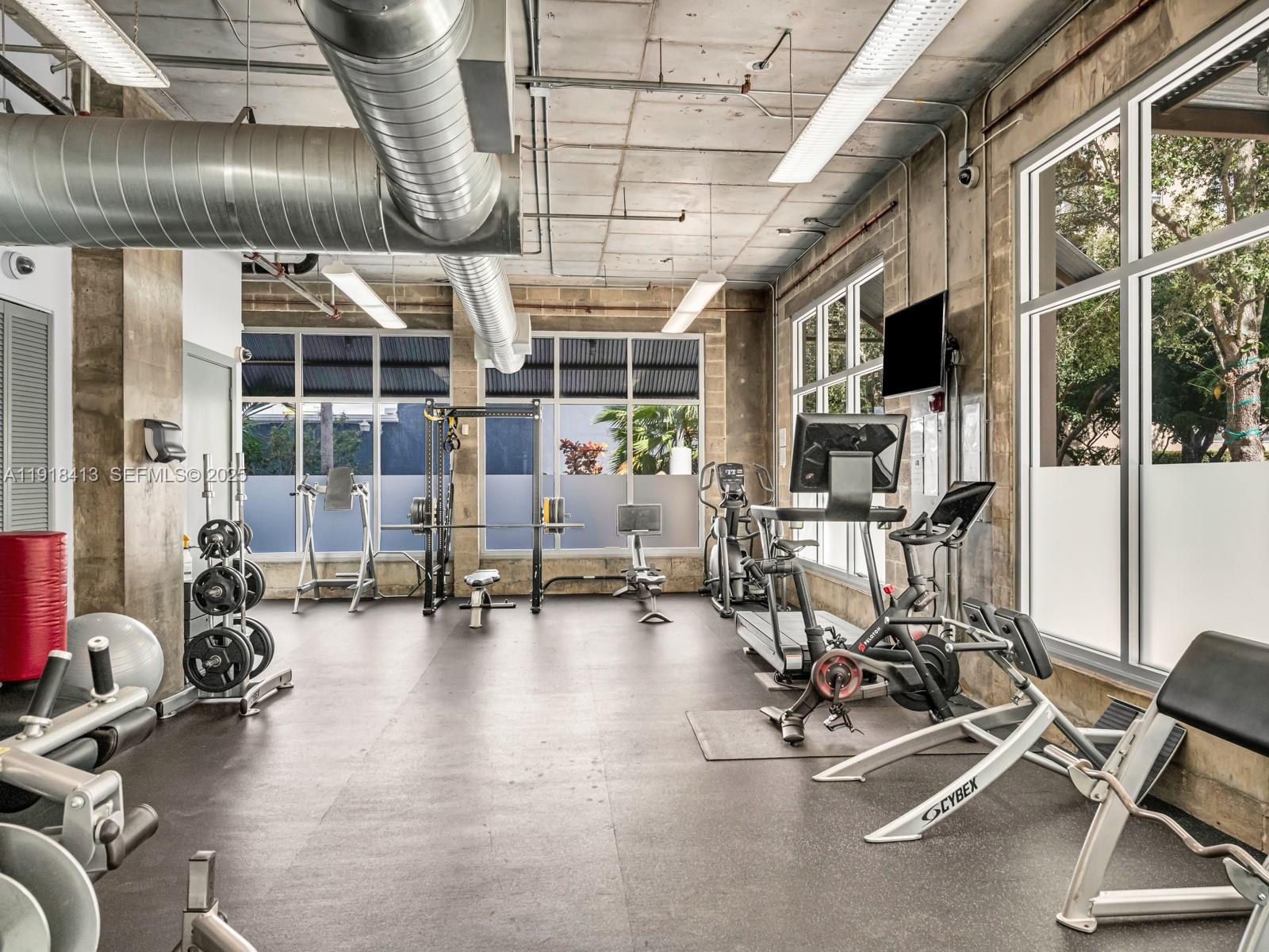 411 Northwest 1st Avenue, Unit 401 Fort Lauderdale, FL 33301 - Photo 49 of 53 a view of a room with gym equipment