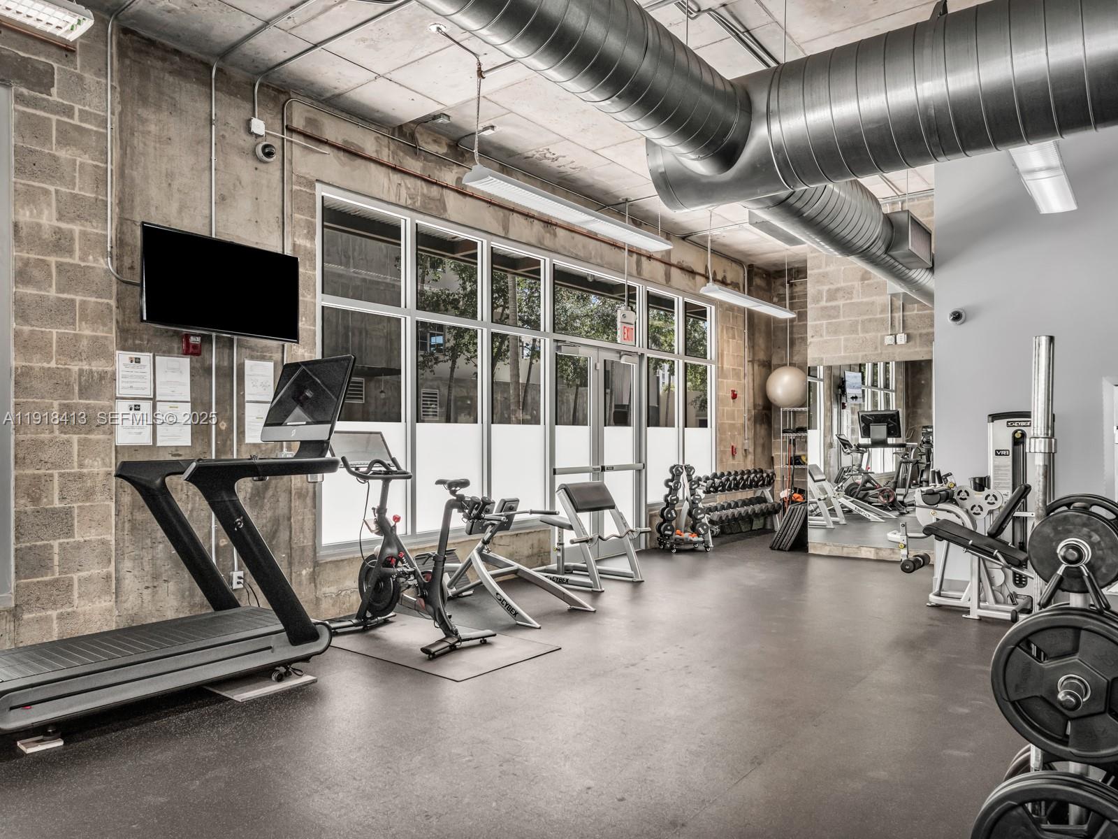 411 Northwest 1st Avenue, Unit 401 Fort Lauderdale, FL 33301 - Photo 50 of 53 a view of a room with gym equipment