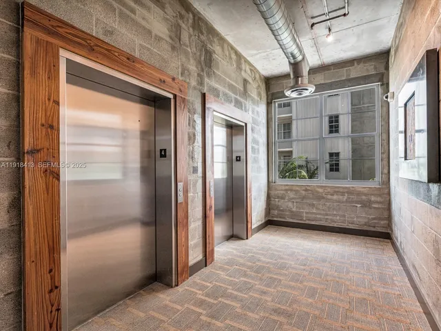a kitchen with sink cabinets and wooden floor