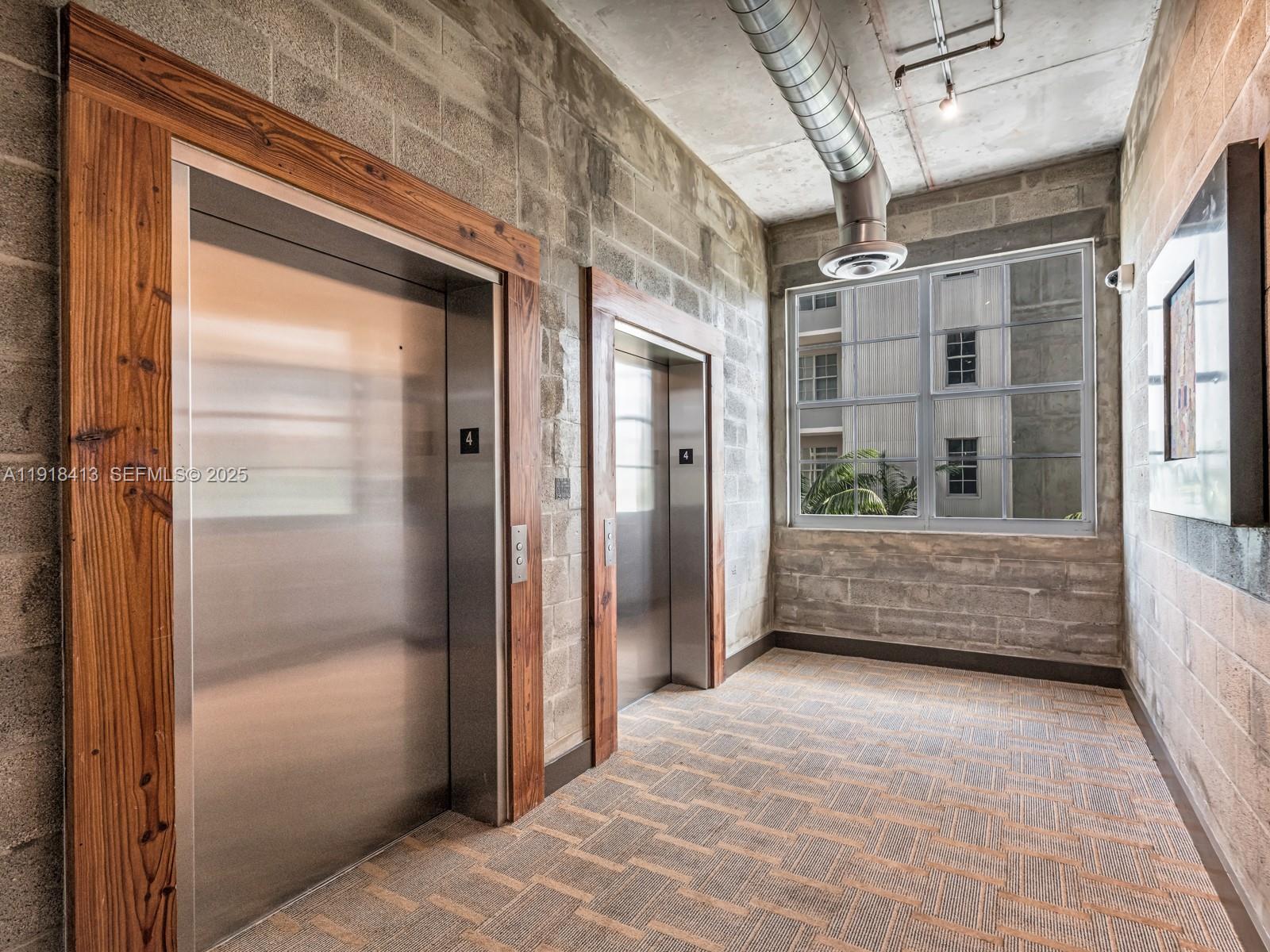 411 Northwest 1st Avenue, Unit 401 Fort Lauderdale, FL 33301 - Photo 5 of 53 a view of gallery with windows