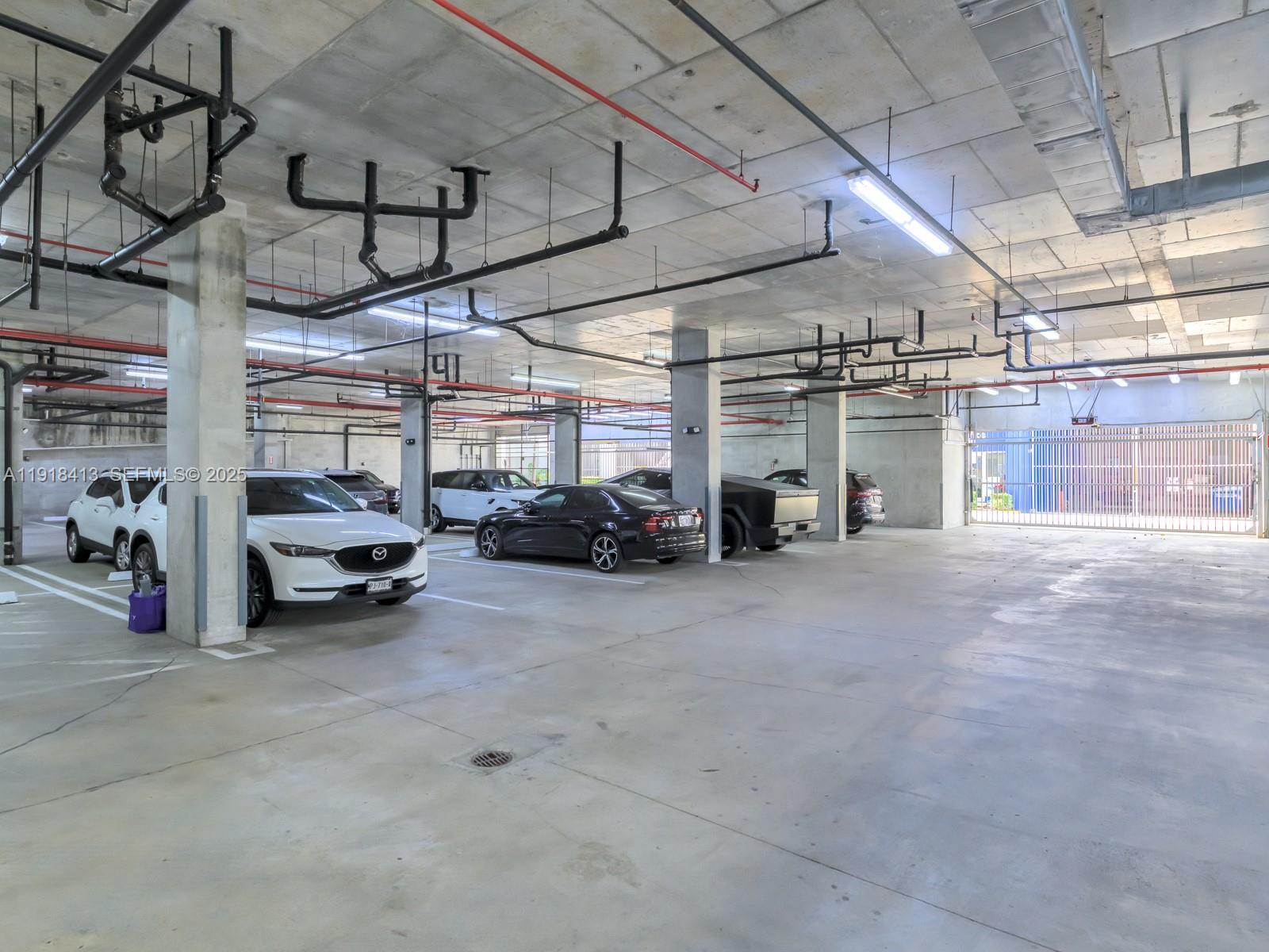 411 Northwest 1st Avenue, Unit 401 Fort Lauderdale, FL 33301 - Photo 52 of 53 a view of parking garage with cars
