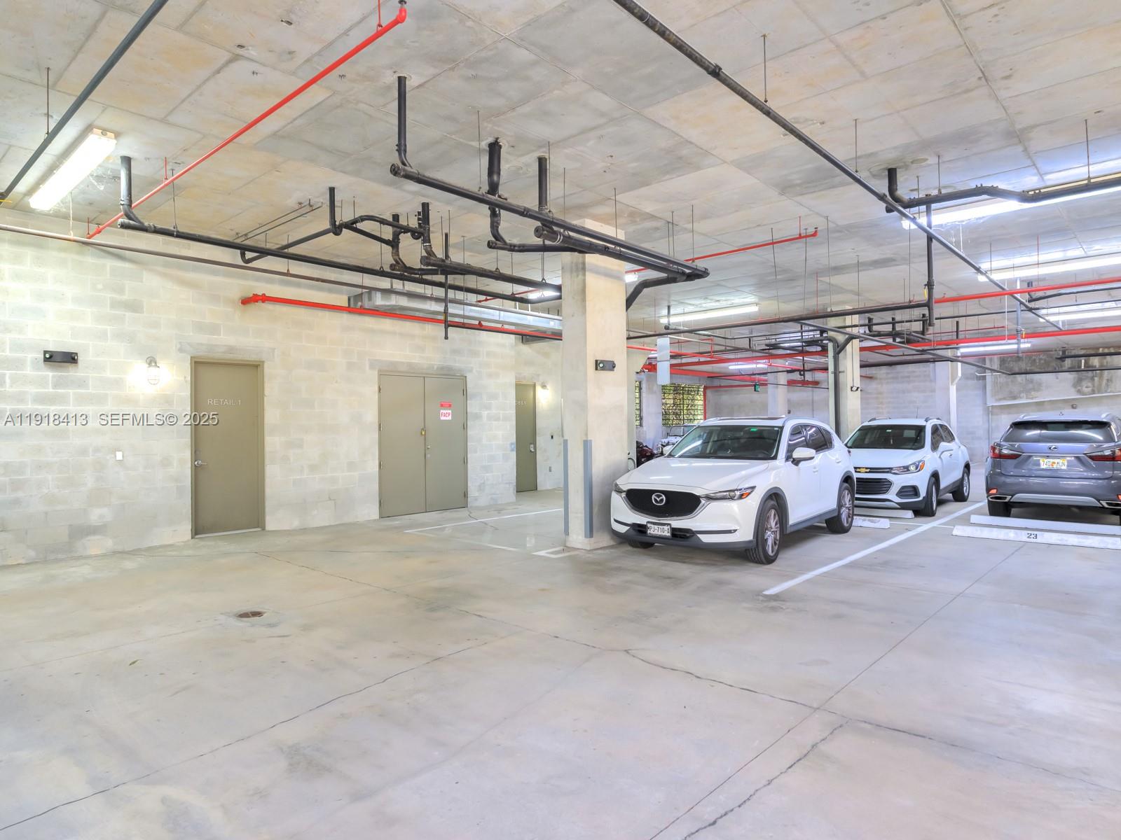 411 Northwest 1st Avenue, Unit 401 Fort Lauderdale, FL 33301 - Photo 53 of 53 a view of parking garage with cars