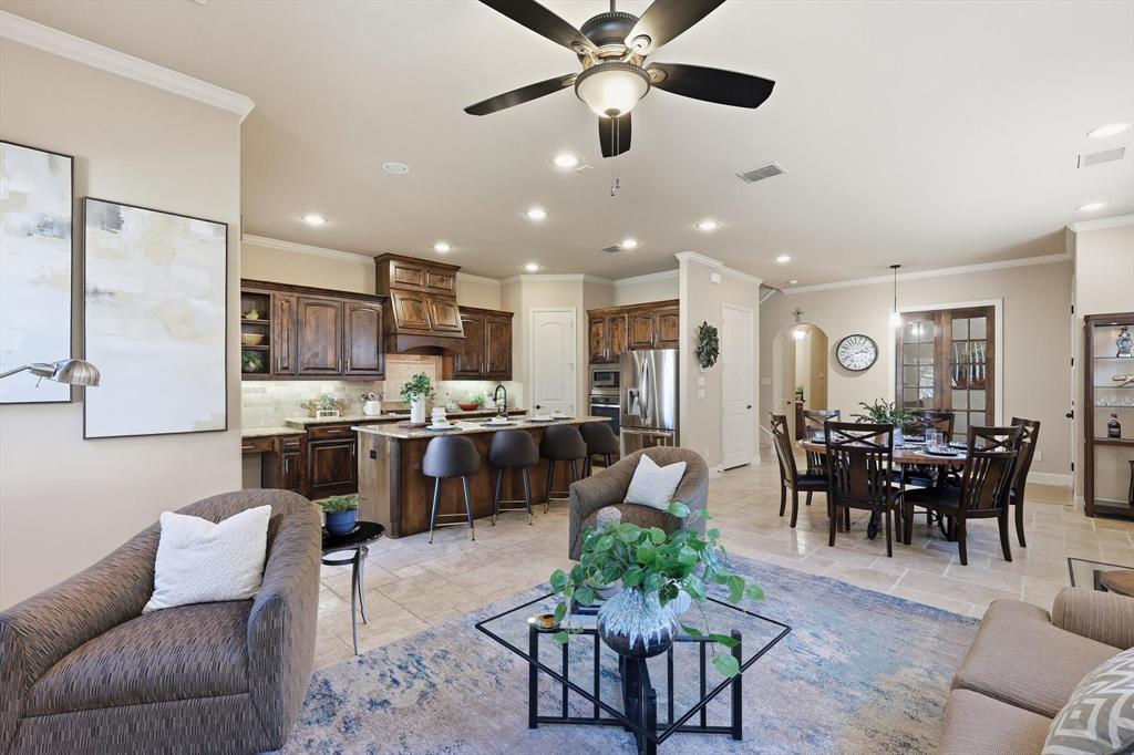 617 Two Creeks Plaza Richardson, TX 75080 - Photo 11 of 40 a living room with stainless steel appliances kitchen island furniture and a view of kitchen