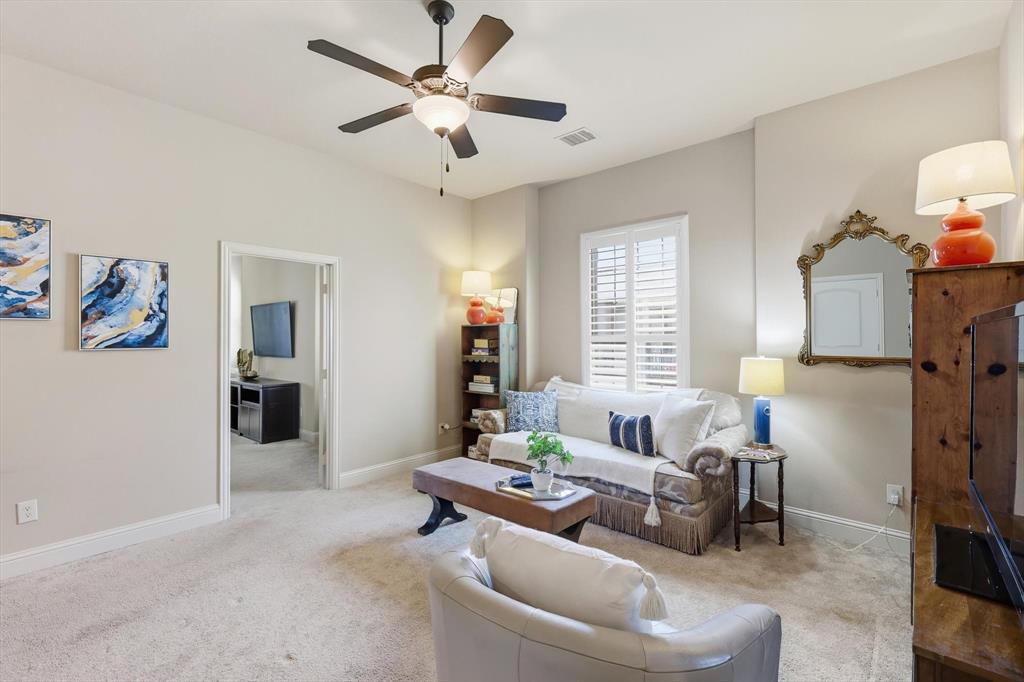 617 Two Creeks Plaza Richardson, TX 75080 - Photo 24 of 40 a living room with furniture and a chandelier