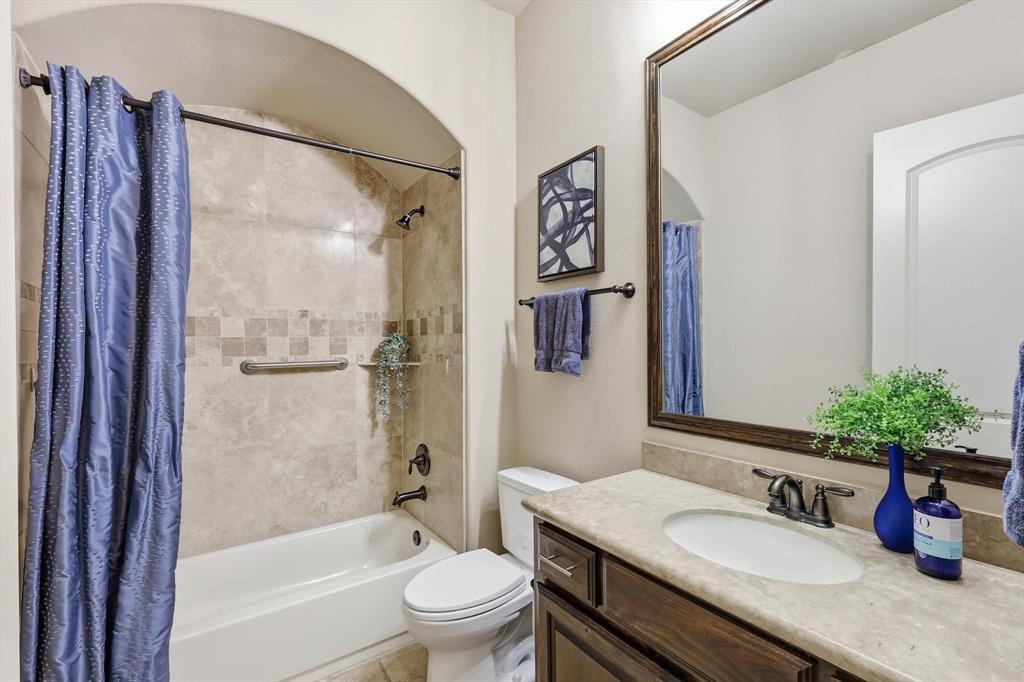 617 Two Creeks Plaza Richardson, TX 75080 - Photo 31 of 40 a bathroom with a granite countertop sink toilet and shower