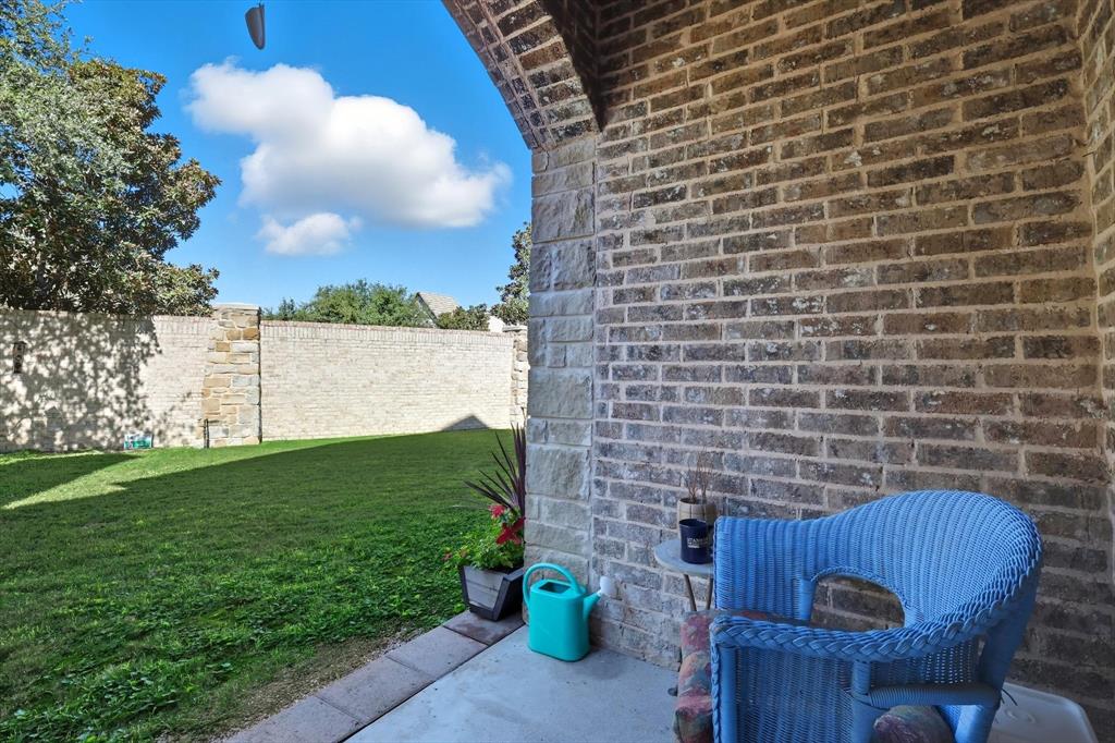 617 Two Creeks Plaza Richardson, TX 75080 - Photo 32 of 40 a view of a backyard with plants and a lake