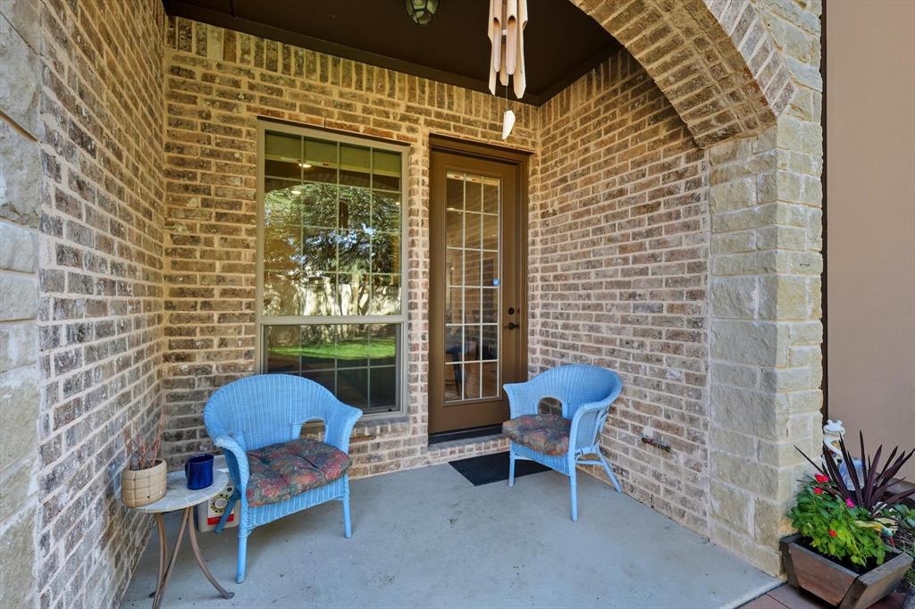 617 Two Creeks Plaza Richardson, TX 75080 - Photo 33 of 40 a brick house with table and chairs