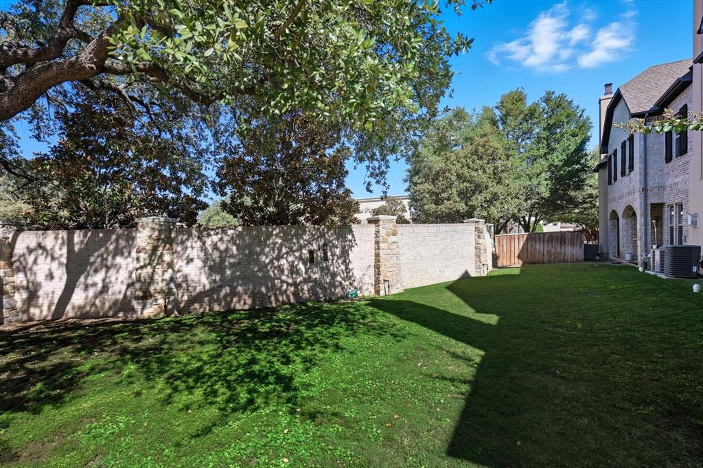 617 Two Creeks Plaza Richardson, TX 75080 - Photo 34 of 40 a view of a house with a yard