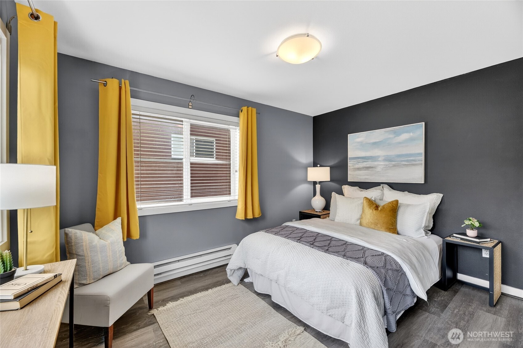 321 East Thomas Street, Unit 303 Seattle, WA 98102 - Photo 11 of 24 a bedroom with a bed and a couch
