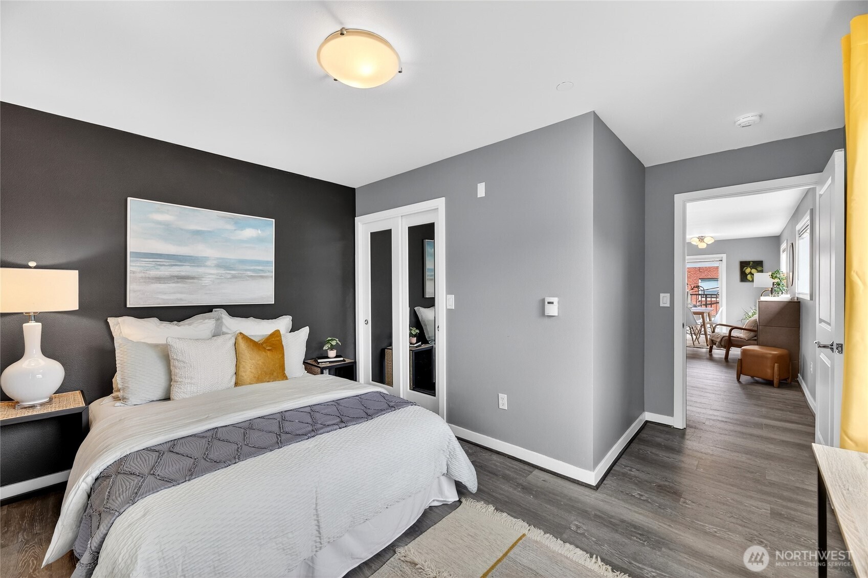 321 East Thomas Street, Unit 303 Seattle, WA 98102 - Photo 12 of 24 a bedroom with a large bed and a large window