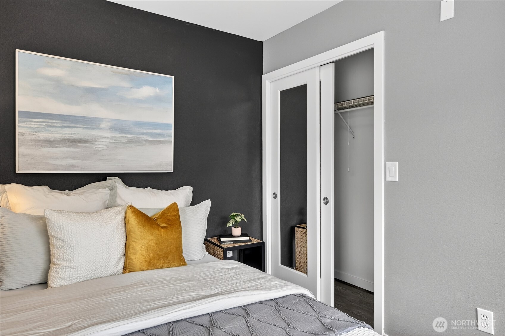 321 East Thomas Street, Unit 303 Seattle, WA 98102 - Photo 13 of 24 a bed room with a bed and a painting