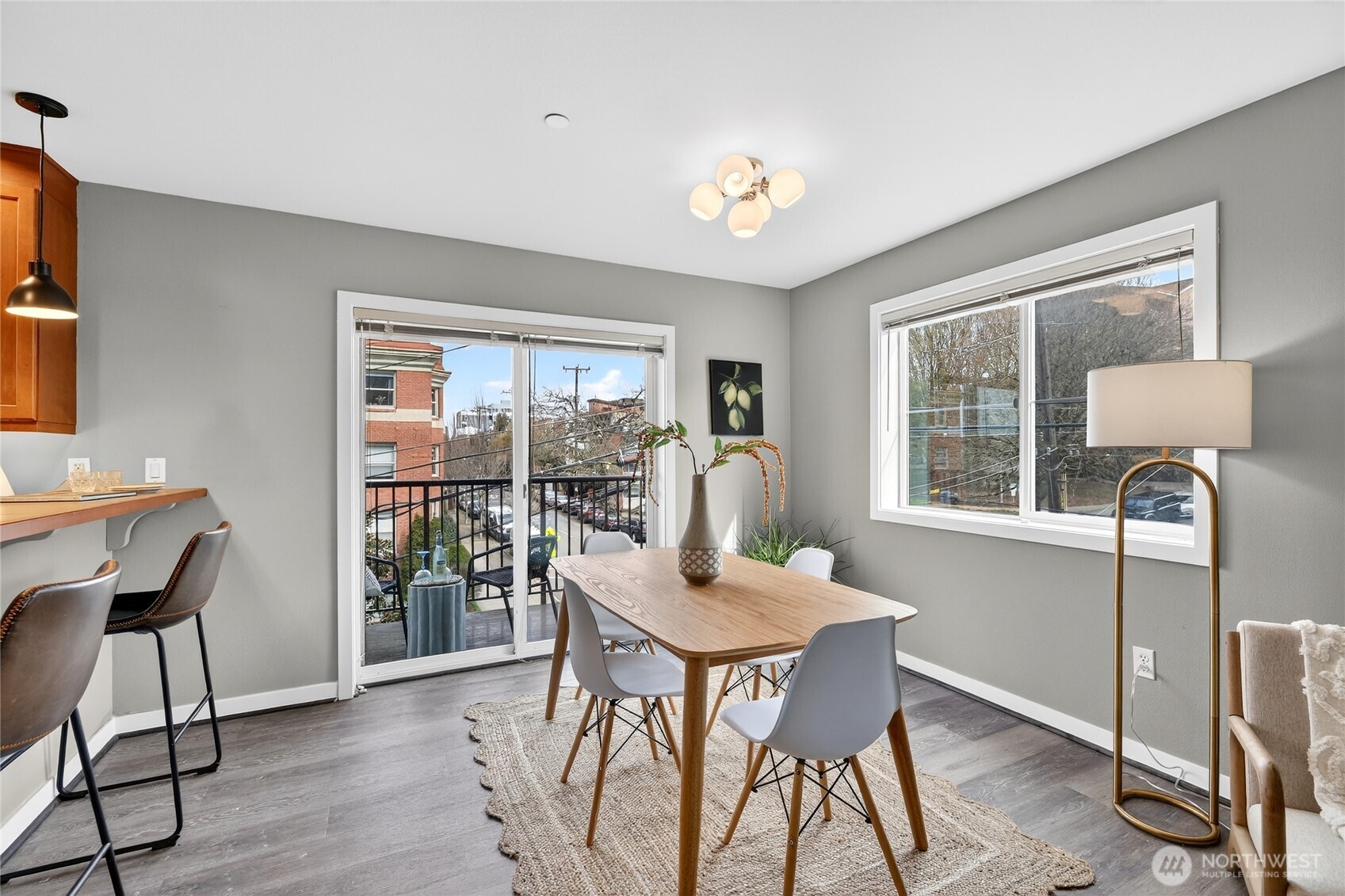 321 East Thomas Street, Unit 303 Seattle, WA 98102 - Photo 9 of 24 a dining room with furniture window outside view and wooden floor