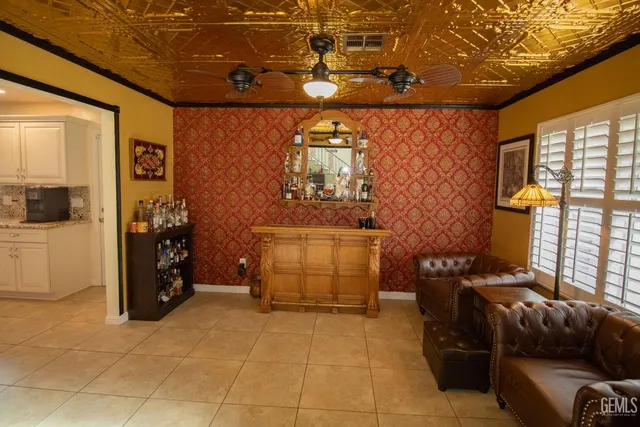 a kitchen with stainless steel appliances kitchen island granite countertop a sink stove cabinets and refrigerator