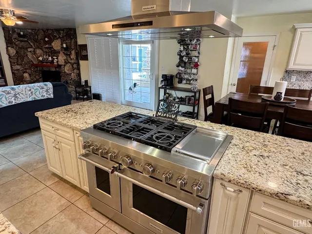 a living room with lots of furniture and a fireplace