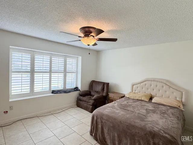 a bed room with a bed and a television