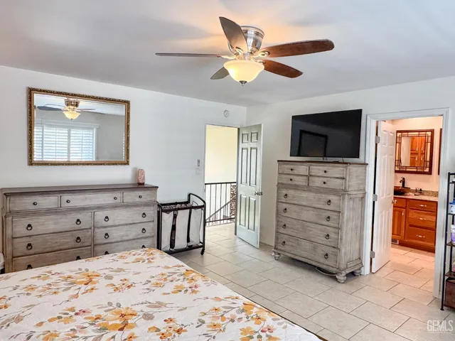 a view of a house with backyard sitting area and garden
