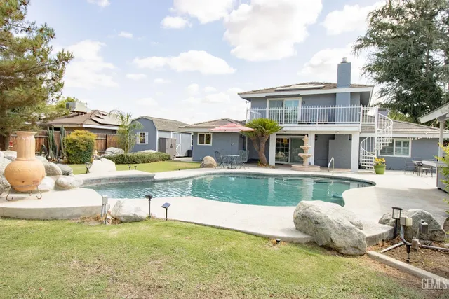 a view of a porch with furniture and yard