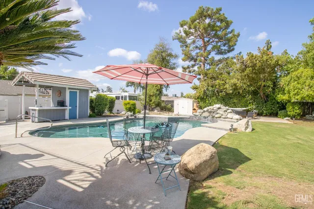an aerial view of a house with a swimming pool