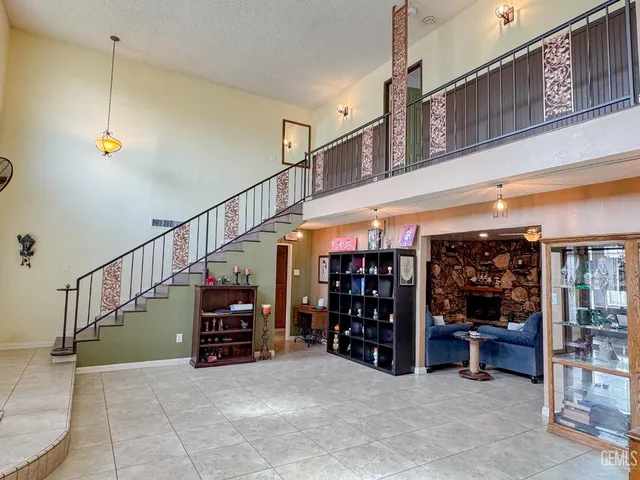 a kitchen with a stove a sink a dining table and chairs