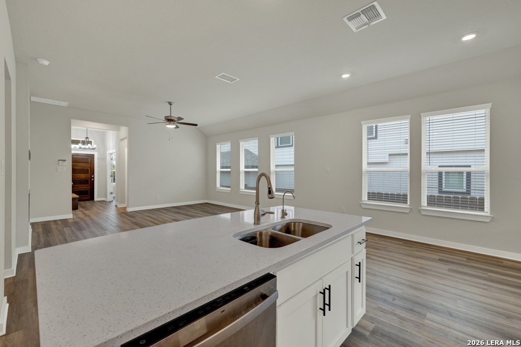 1433 Escarpment Road New Braunfels, TX 78132 - Photo 14 of 37 a kitchen with kitchen island a sink and wooden floor