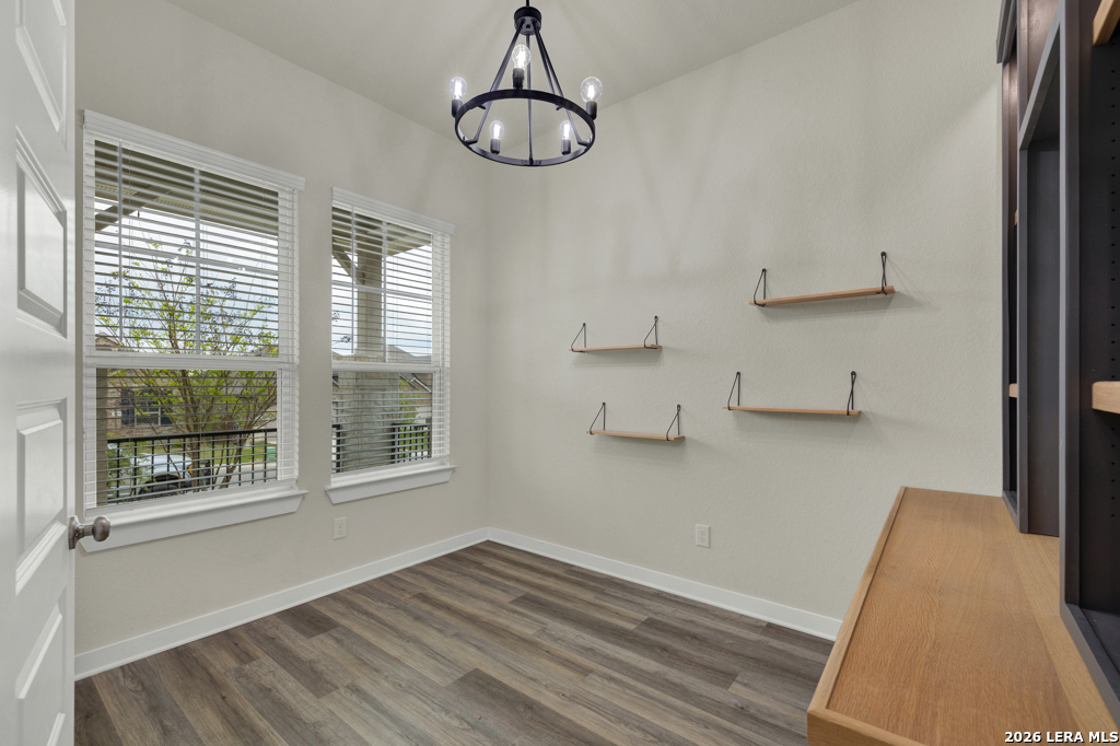 1433 Escarpment Road New Braunfels, TX 78132 - Photo 17 of 37 a view of empty room with wooden floor and fan