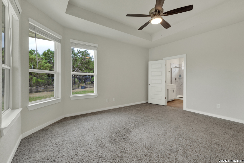 1433 Escarpment Road New Braunfels, TX 78132 - Photo 18 of 37 an empty room with windows and fan