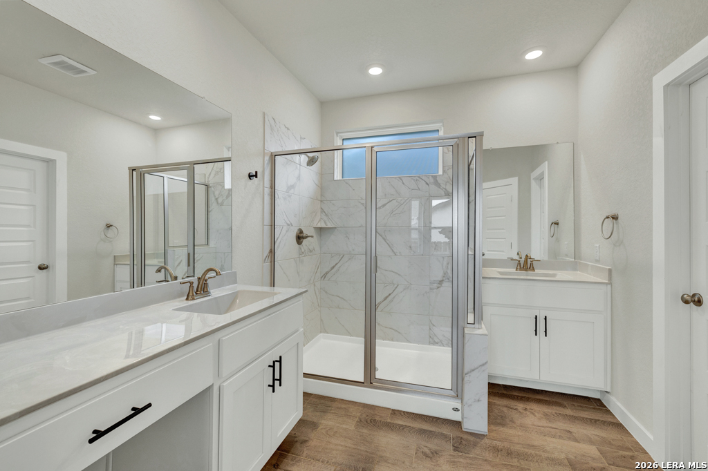 1433 Escarpment Road New Braunfels, TX 78132 - Photo 20 of 37 a spacious bathroom with double sink and shower