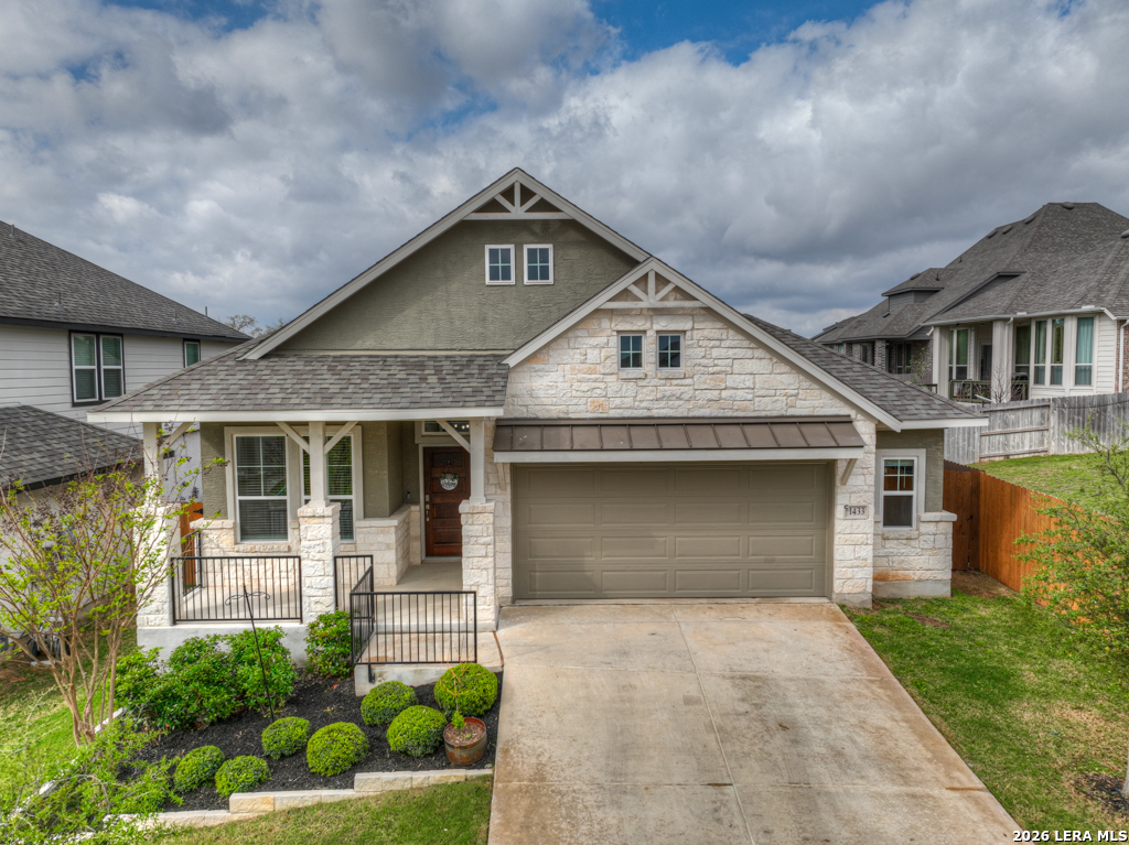 1433 Escarpment Road New Braunfels, TX 78132 - Photo 2 of 37 a front view of a house with a garden